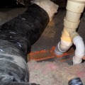 A one-part foam that is being used to seal a gap around an attic plumbing vent sack